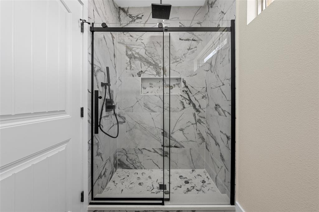 317 North Big Red Way China Spring, TX 76633 - Photo 26 of 40 a bathroom with a glass shower door