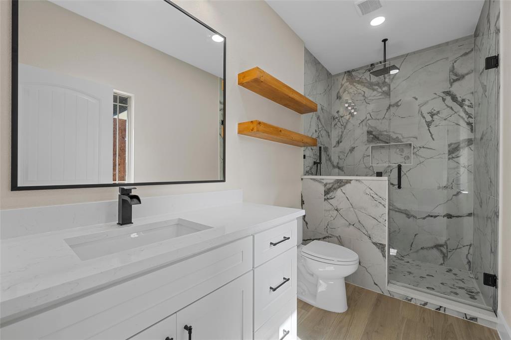 317 North Big Red Way China Spring, TX 76633 - Photo 27 of 40 a bathroom with a sink and a mirror