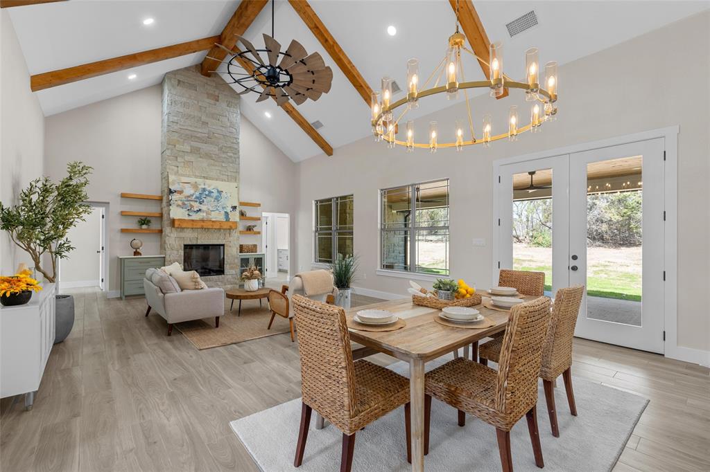 317 North Big Red Way China Spring, TX 76633 - Photo 3 of 40 a living room with fireplace furniture and a chandelier
