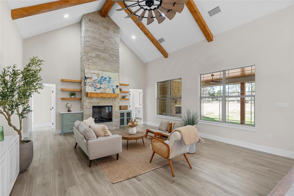 317 North Big Red Way China Spring, TX 76633 - Photo 4 of 40 a living room with furniture and a fireplace