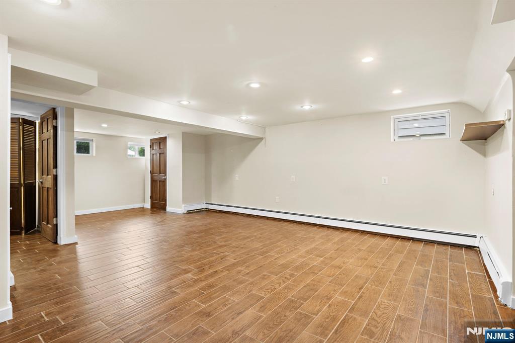 665 9th Street, Unit B Secaucus, NJ 07094 - Photo 13 of 17 a view of an empty room with wooden floor