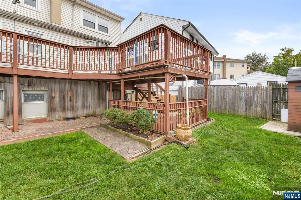 665 9th Street, Unit B Secaucus, NJ 07094 - Photo 16 of 17 a view of a house with a yard and sitting area