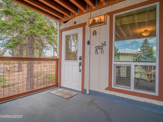 a view of a front door and wooden floor