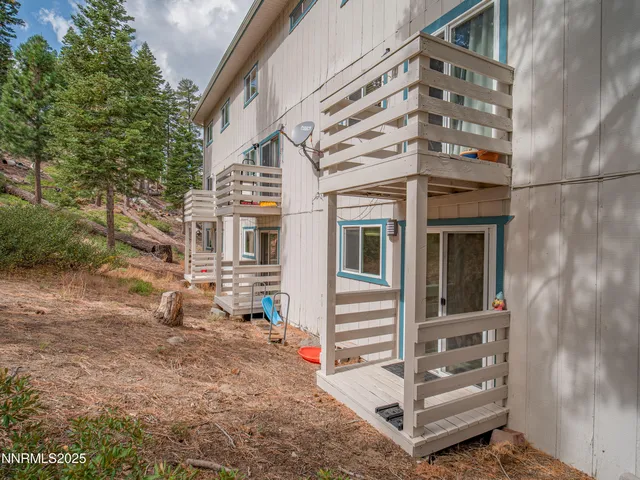 a view of an outdoor space with a table and chairs