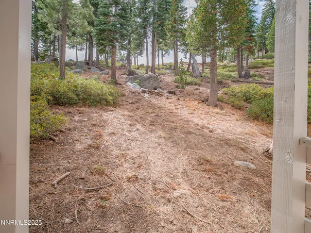 a view of an empty room with a balcony
