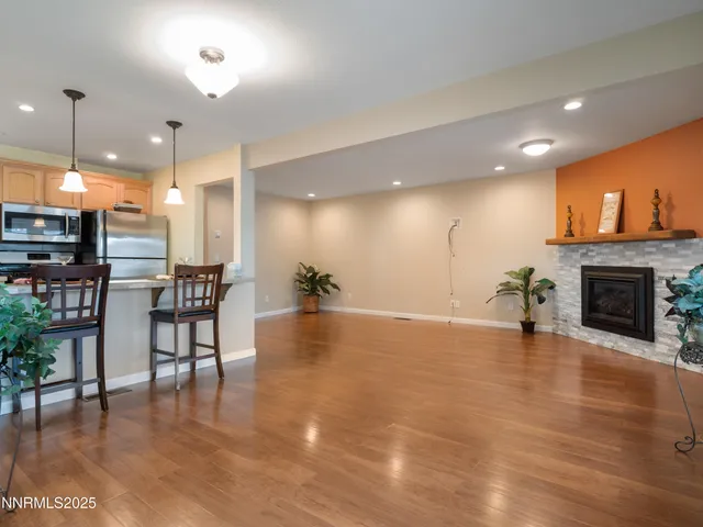 a view of kitchen with furniture and wooden floor