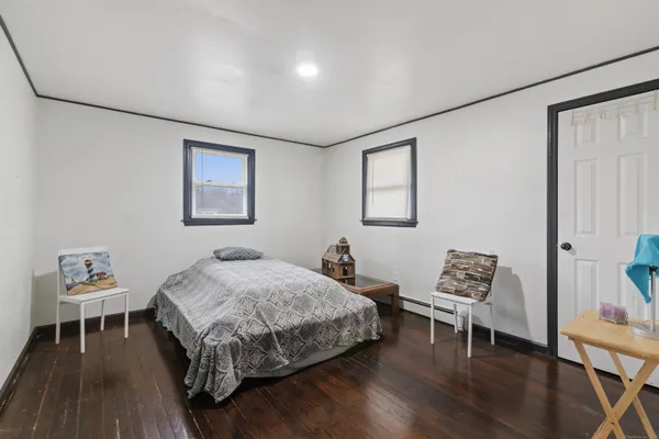 a bedroom with a bed and a table in it