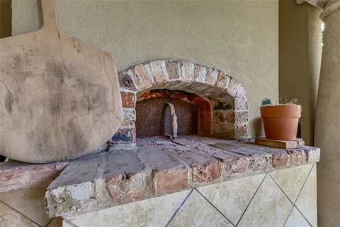 a bed sitting in a bedroom and table chair