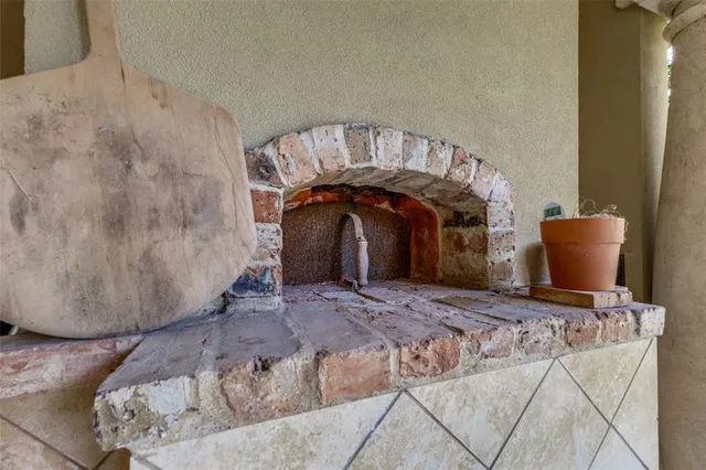 a bed sitting in a bedroom and table chair