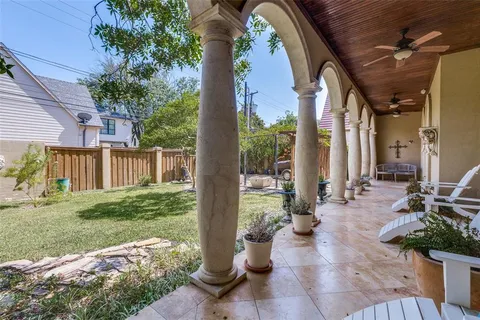 a view of a patio with table and chairs potted plants with wooden floor
