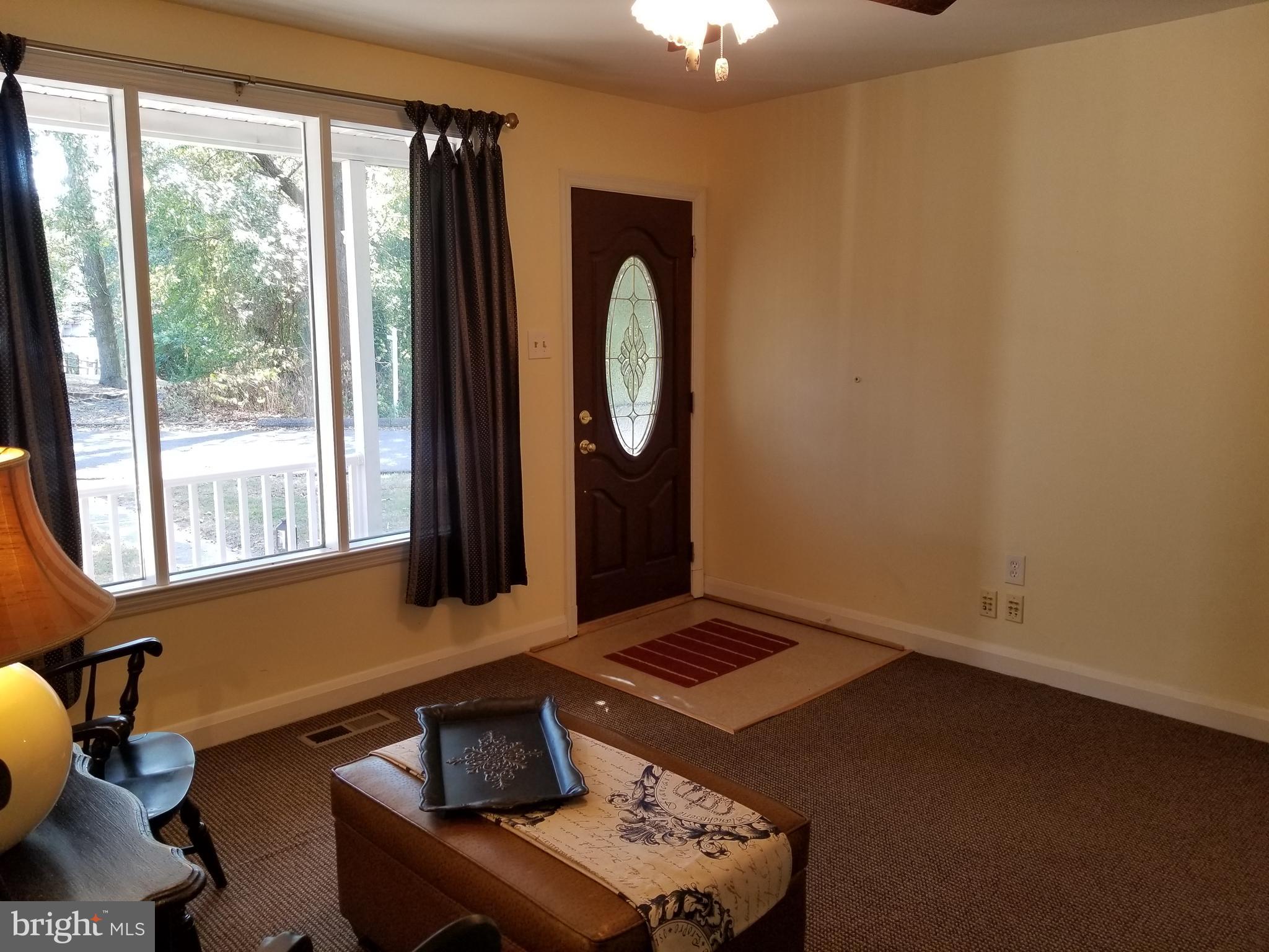 610 Riverside Drive Pasadena, MD 21122 - Photo 46 of 75 Living Room -lots of sunlight & large front window