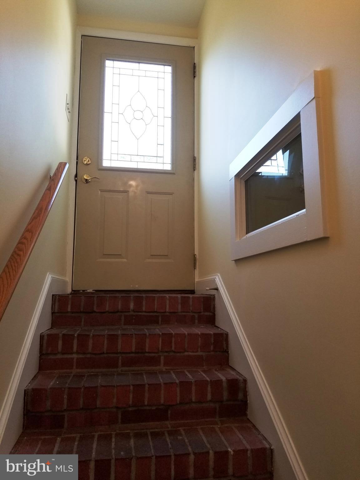610 Riverside Drive Pasadena, MD 21122 - Photo 54 of 75 Back entrance door, foyer down to lower level.