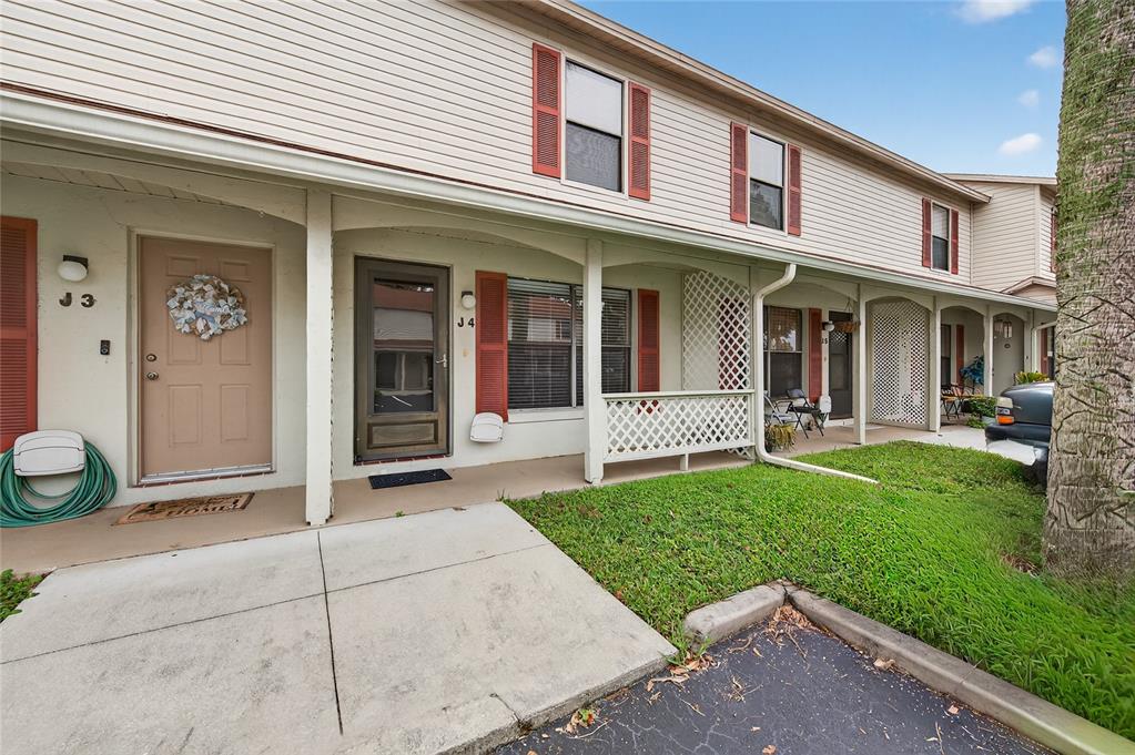 980 Canal View Boulevard, Unit J4 Port Orange, FL 32129 - Photo 1 of 25 a view of a house with a yard