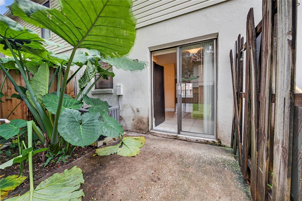 980 Canal View Boulevard, Unit J4 Port Orange, FL 32129 - Photo 18 of 25 a view of a back yard of the house