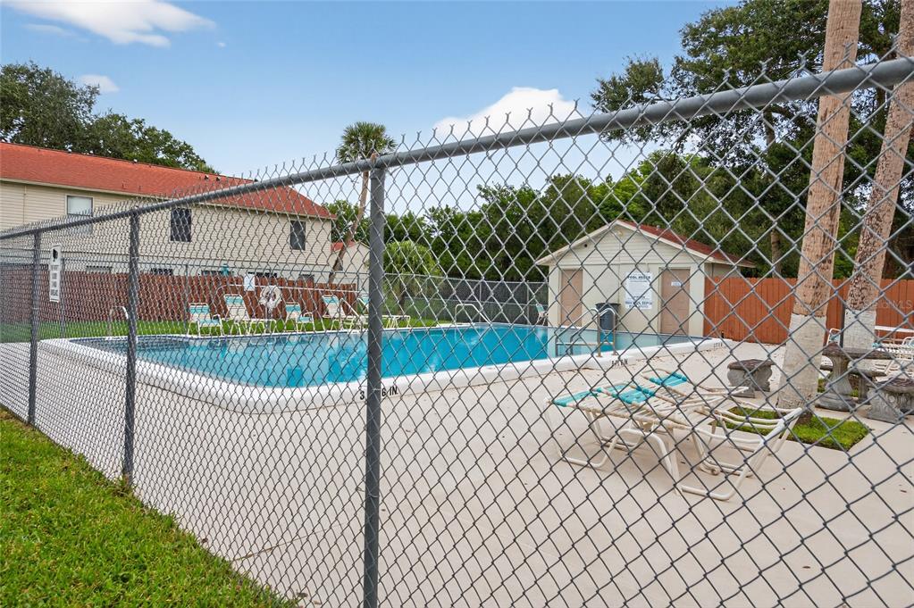980 Canal View Boulevard, Unit J4 Port Orange, FL 32129 - Photo 20 of 25 a view of a wrought iron fences in front of house