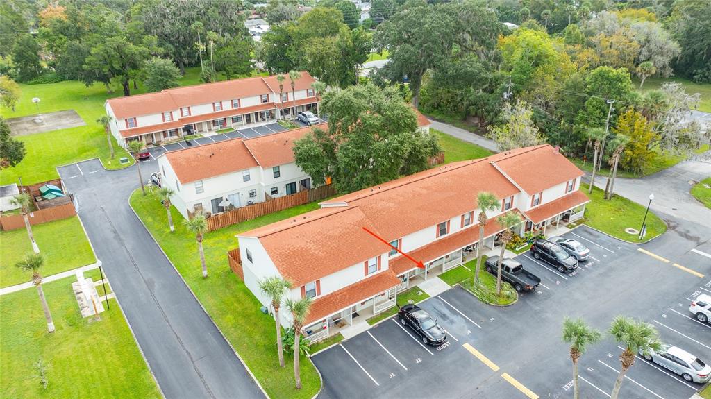 980 Canal View Boulevard, Unit J4 Port Orange, FL 32129 - Photo 21 of 25 an aerial view of a house with a garden and swimming pool
