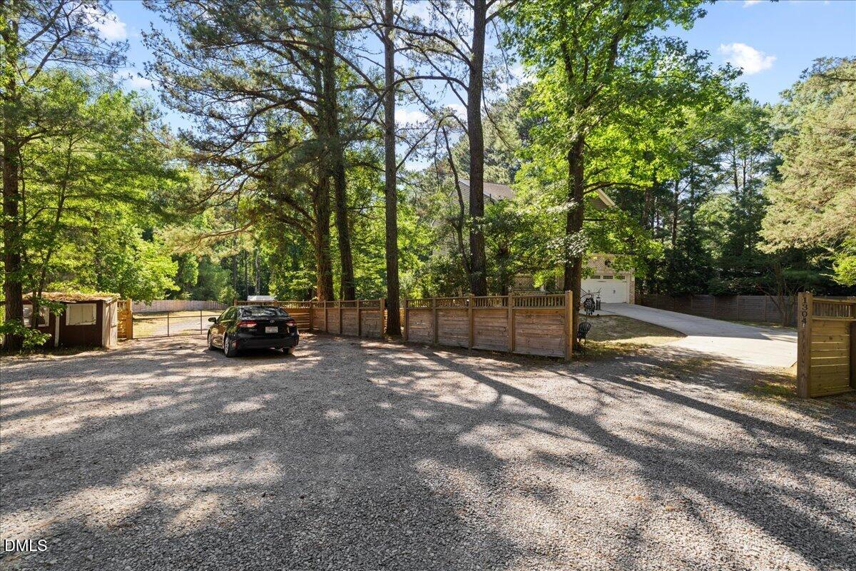 1304 Flying Hawk Road Apex, NC 27523 - Photo 44 of 52 a view of backyard with parked car
