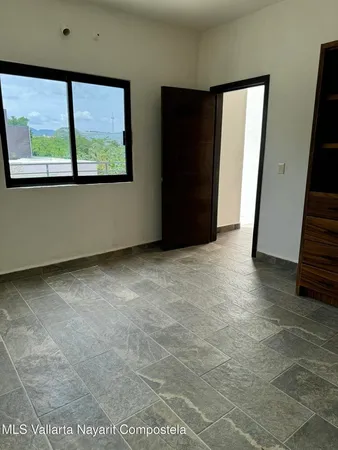 an empty room with windows