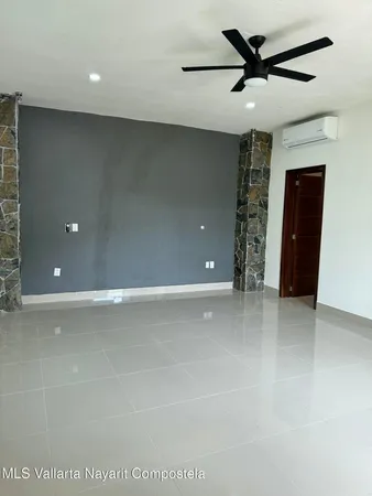 a view of a livingroom with a ceiling fan