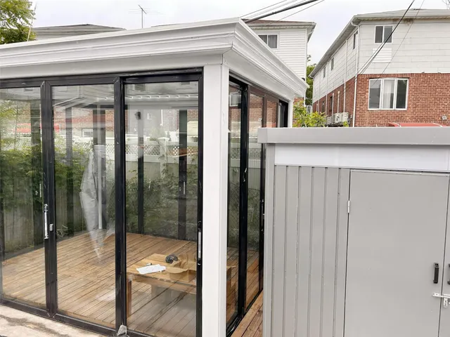 a view of a porch with a floor to ceiling window