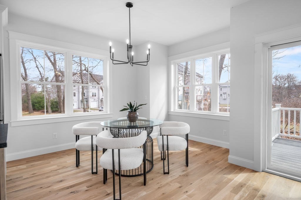 48 Beach Road, Unit C Salisbury, MA 01952 - Photo 14 of 41 a view of a dining room with furniture windows and wooden floor