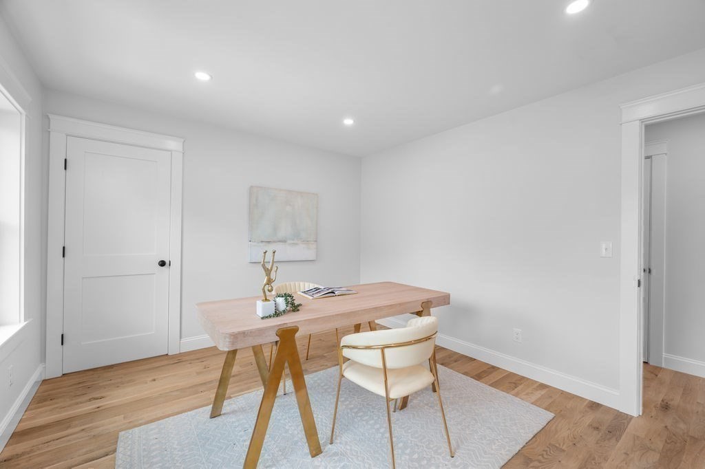 48 Beach Road, Unit C Salisbury, MA 01952 - Photo 26 of 41 a view of a dining room with furniture and wooden floor