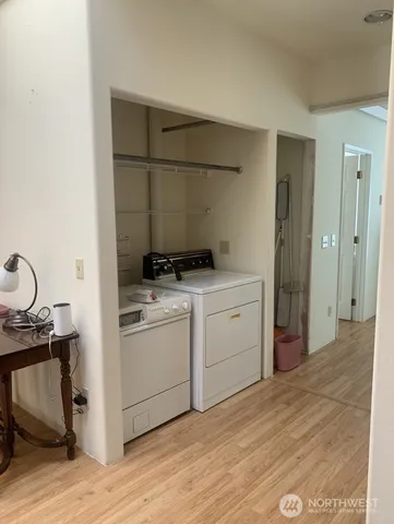 a room with a bed and cabinets