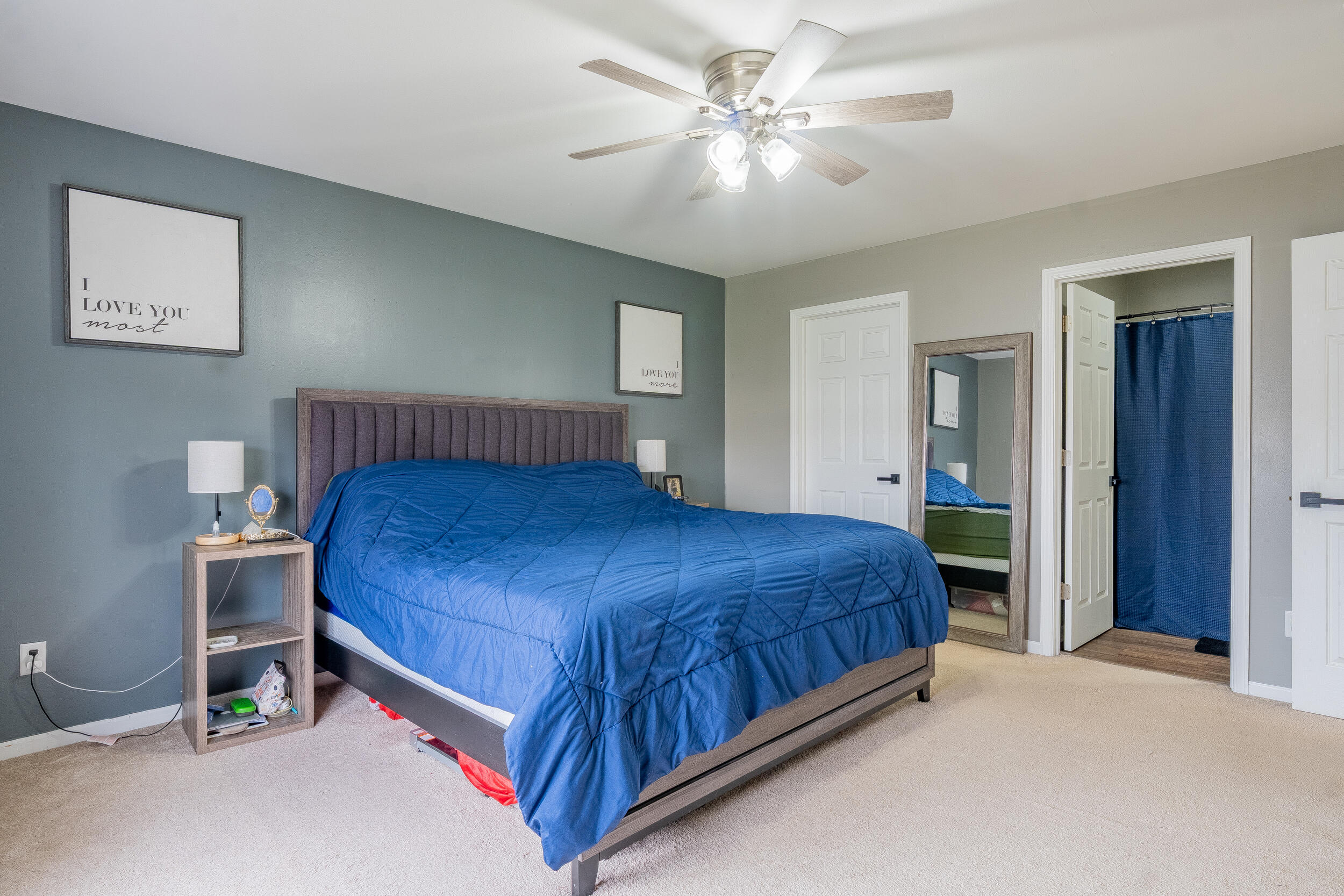 11165 Orange Street Crown Point, IN 46307 - Photo 18 of 33 a bedroom with a large bed and a chandelier
