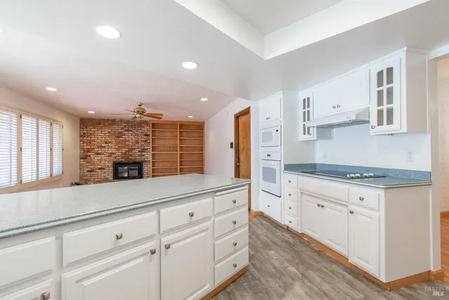 a kitchen with stainless steel appliances granite countertop a stove and a sink