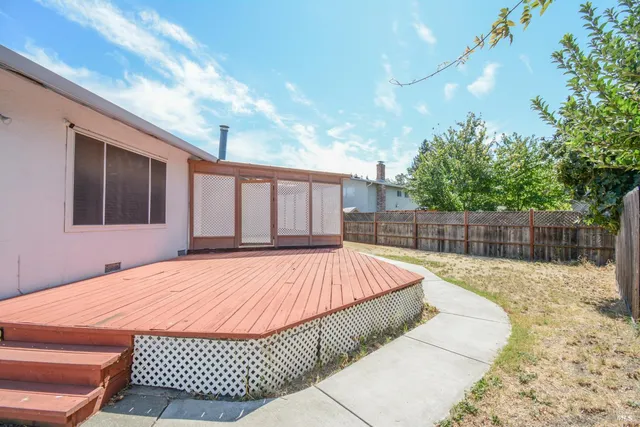a swimming pool with wooden fence