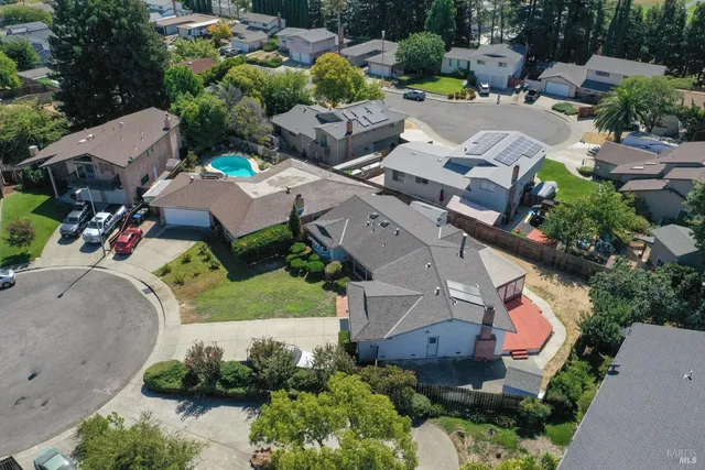 an aerial view of a house with a garden