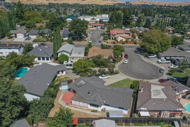 an aerial view of residential houses with outdoor space