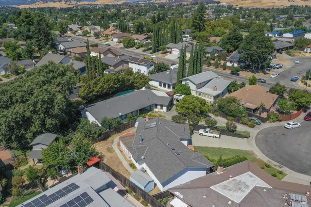 an aerial view of residential houses with outdoor space