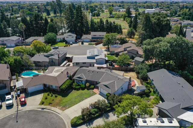 an aerial view of a house with a garden