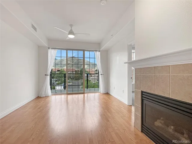 a view of an empty room with windows