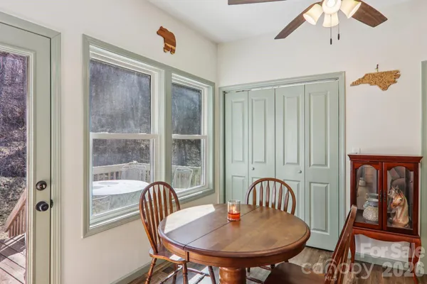 a view of a dining room with furniture window and wooden floor