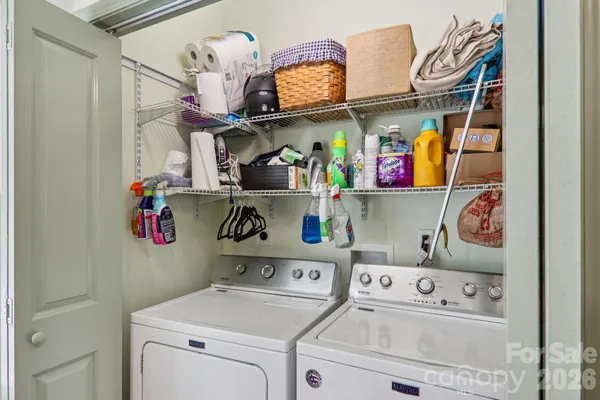 a view of storage and utility room with washer and dryer