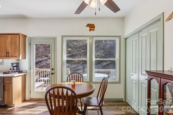 a view of a dining room with furniture window and outside view