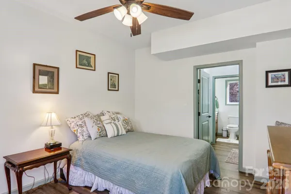 a bedroom with a bed and a table in it