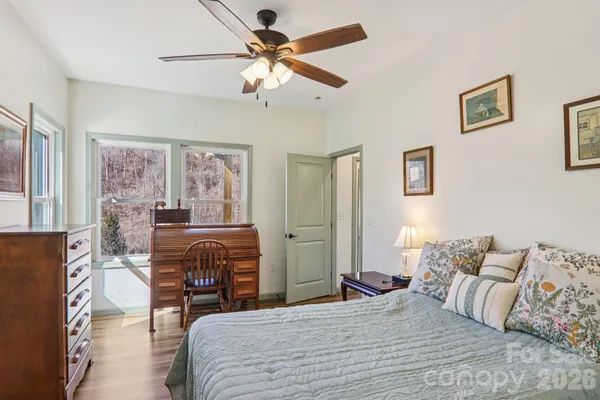 a bedroom with furniture and a fireplace