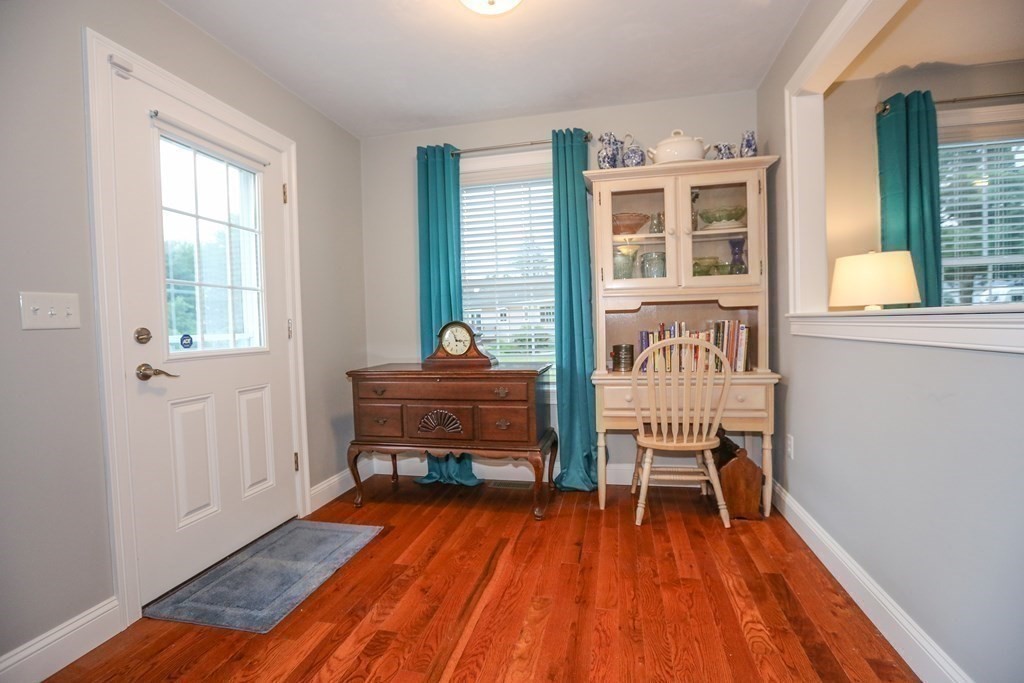 3 Jade Hill Road Auburn, MA 01501 - Photo 12 of 27 a reading room with wooden floor and furniture