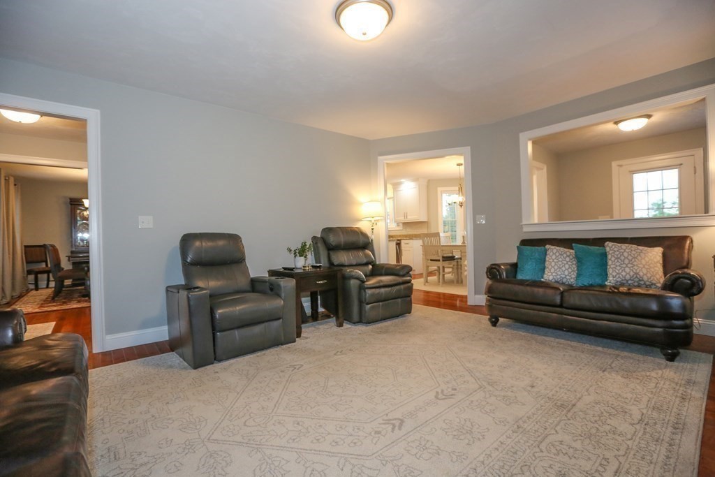 3 Jade Hill Road Auburn, MA 01501 - Photo 14 of 27 a living room with furniture and a lamp