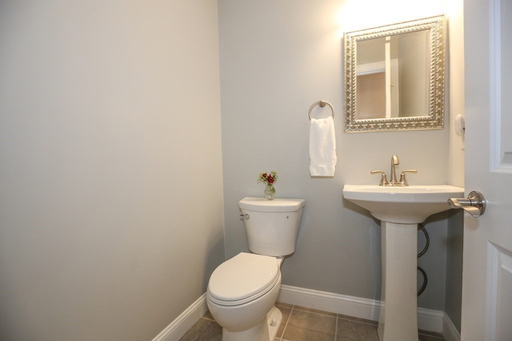 3 Jade Hill Road Auburn, MA 01501 - Photo 16 of 27 a bathroom with a sink toilet and mirror