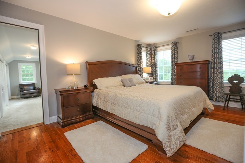 3 Jade Hill Road Auburn, MA 01501 - Photo 17 of 27 a bedroom with a bed and wooden floor