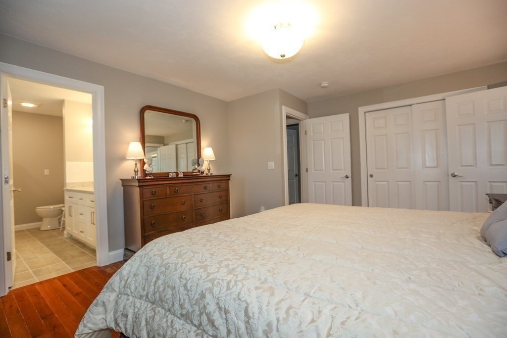 3 Jade Hill Road Auburn, MA 01501 - Photo 18 of 27 a bedroom with a bed and a bathroom