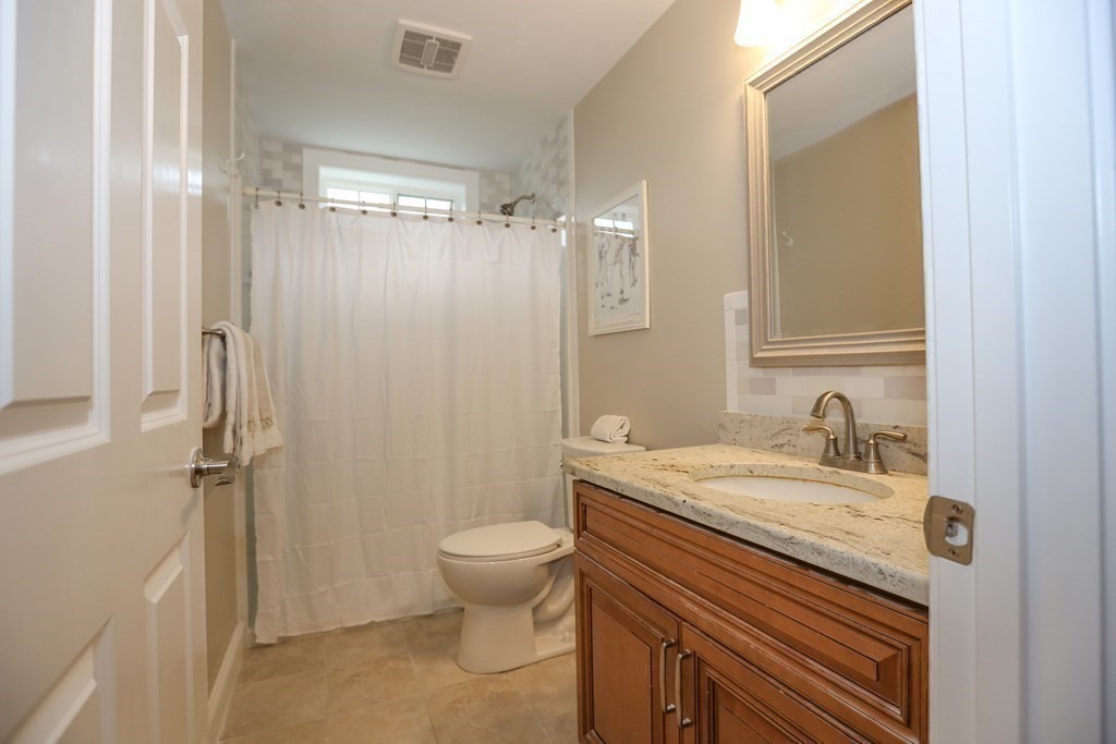 3 Jade Hill Road Auburn, MA 01501 - Photo 24 of 27 a bathroom with a granite countertop sink toilet and shower