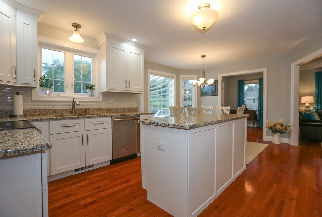 3 Jade Hill Road Auburn, MA 01501 - Photo 8 of 27 a kitchen with granite countertop white cabinets and white appliances