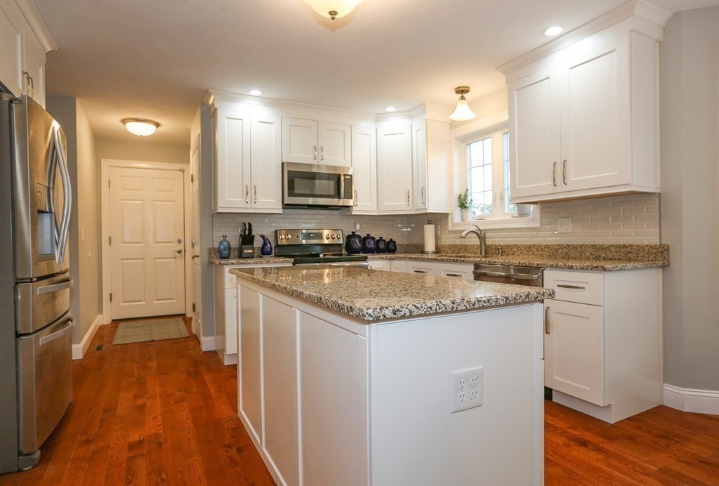3 Jade Hill Road Auburn, MA 01501 - Photo 9 of 27 a kitchen with stainless steel appliances granite countertop a refrigerator a sink and a stove