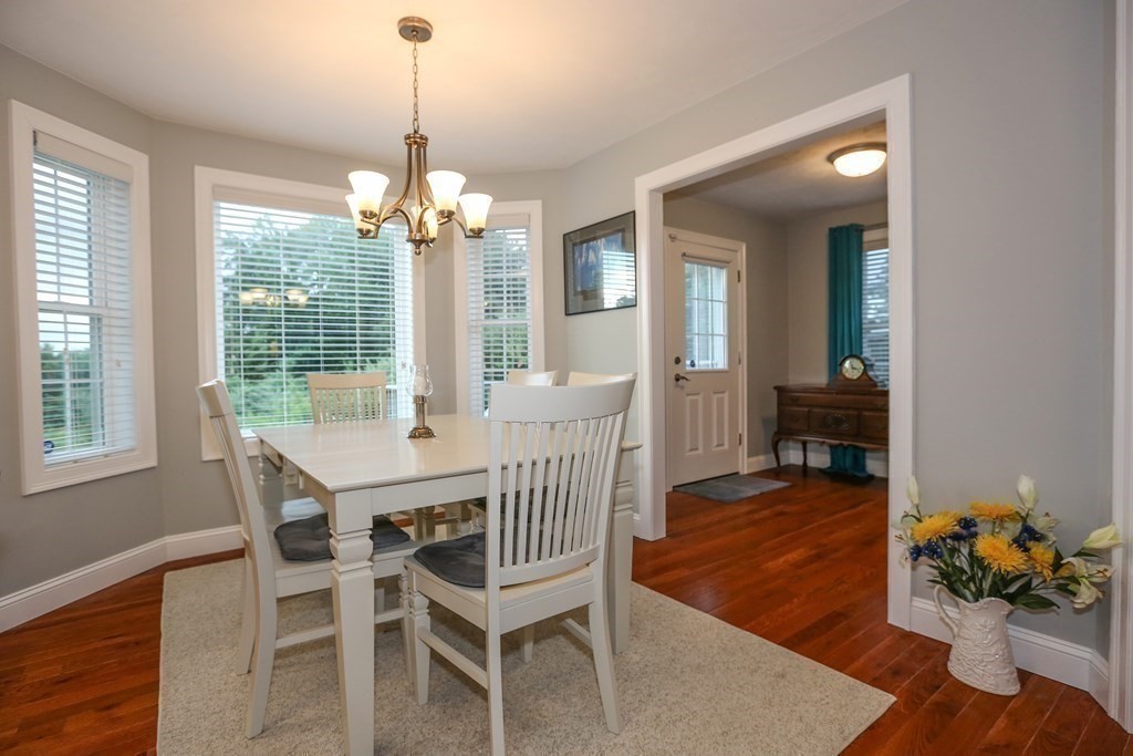 3 Jade Hill Road Auburn, MA 01501 - Photo 10 of 27 a dining room with furniture potted plants and wooden floor