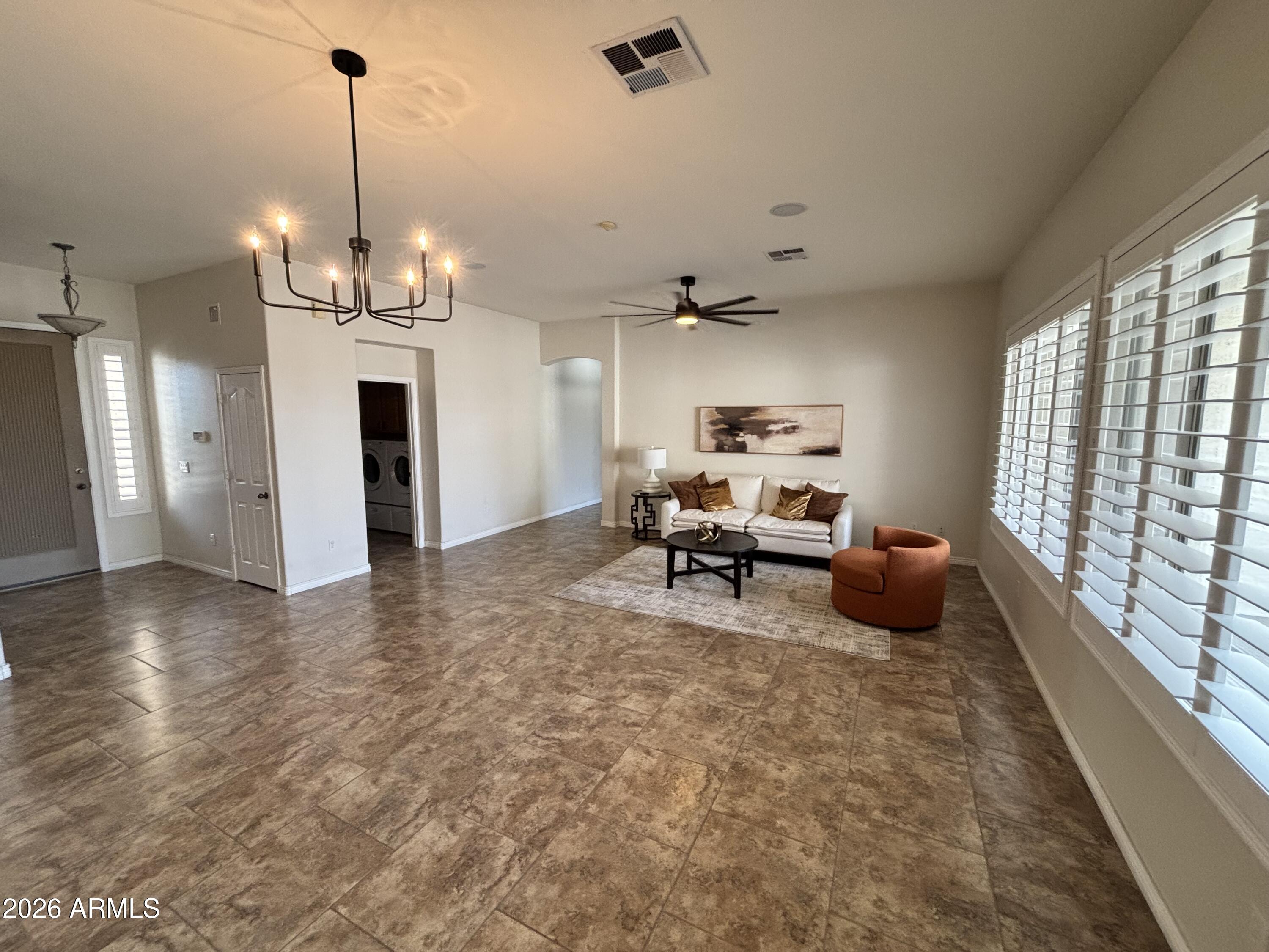 434 East Sheffield Avenue Gilbert, AZ 85296 - Photo 11 of 52 a living room with furniture windows and a chandelier